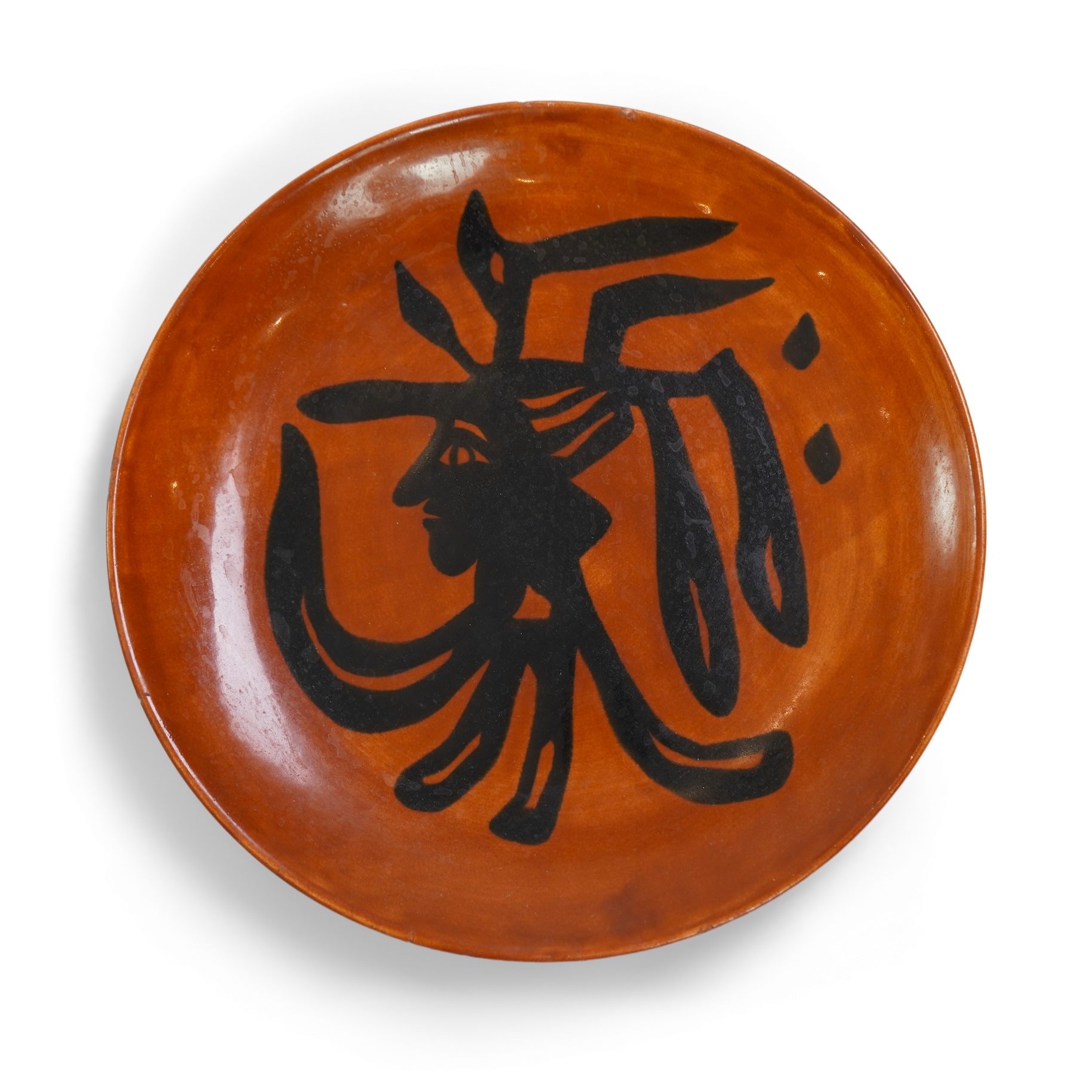 Jean Lurçat (1892-1966): A rust glazed earthenware plate, decorated with a stylised central figure